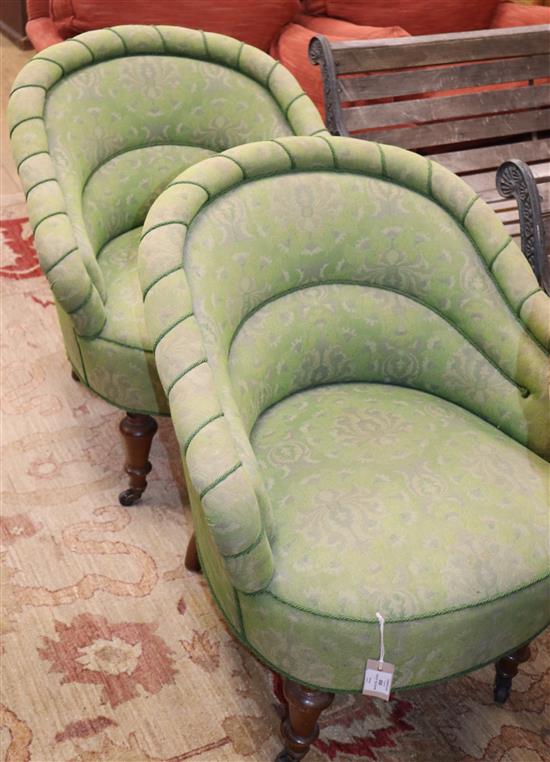 A pair of Victorian upholstered tub chairs